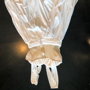 White knee length flowy dress.